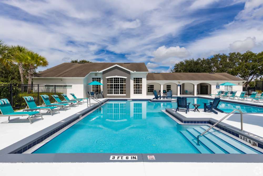 Resort-style pool with lounge chairs at Highpoint Club in Orlando, Florida