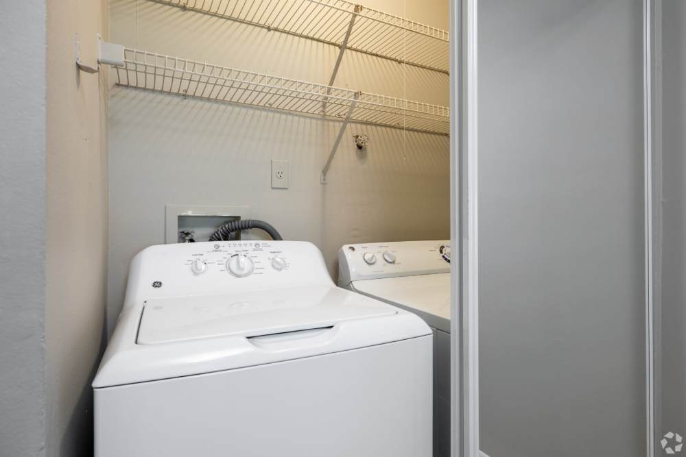 Laundry room with washer and dryer at Highpoint Club in Orlando, Florida