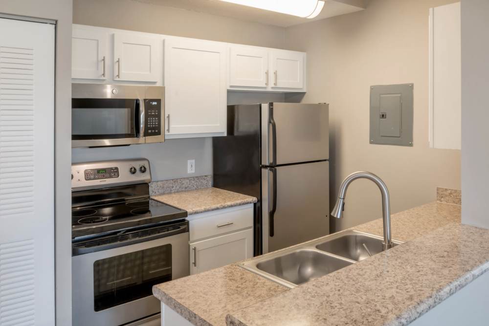 Granite countertops with stainless steel appliances at Highpoint Club in Orlando, Florida