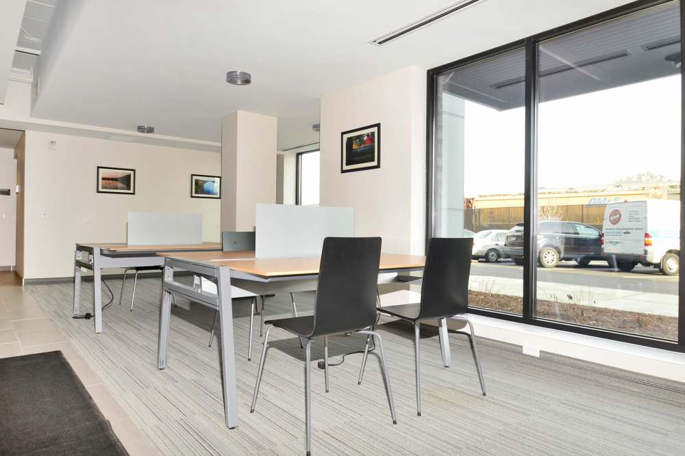 Modern coworking space with desks at Longfellow Station in Minneapolis, Minnesota