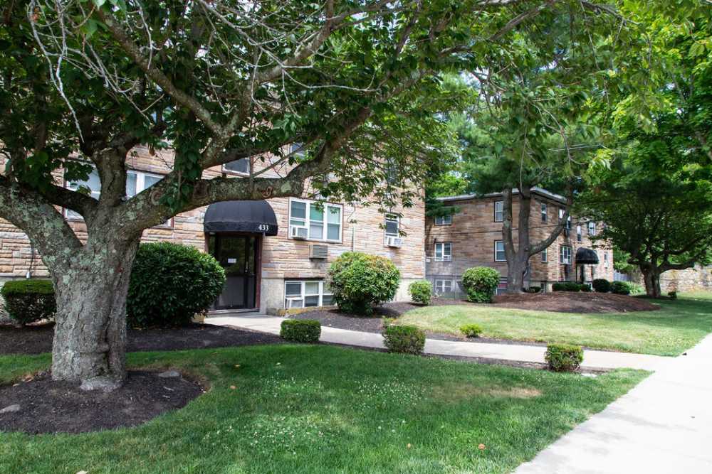 Tree shading pathway to apartment entrance near Westfield Condominium in Brockton, Massachusetts