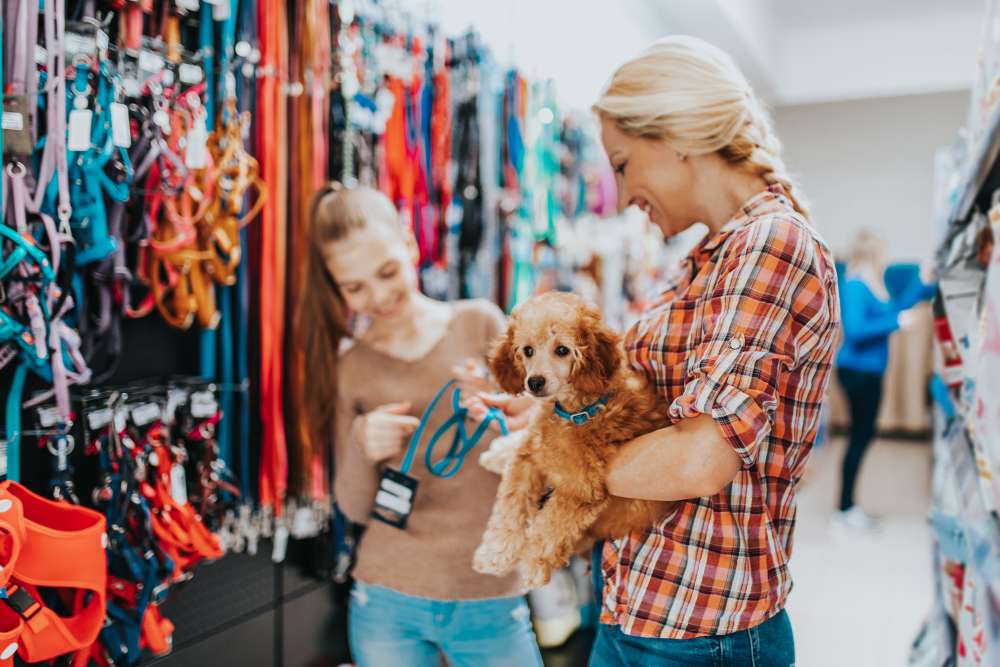 A resident with their pet at a nearby pet store