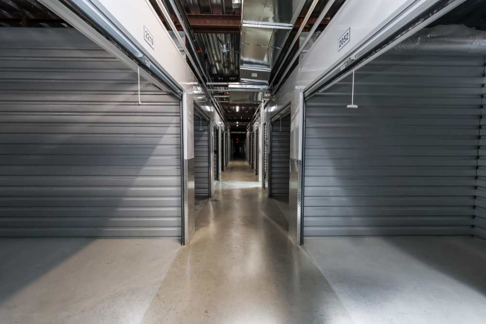 Drive-up storage aisle with open units and wide access lane at Your Storage Units Ft Pierce in Fort Pierce, Florida