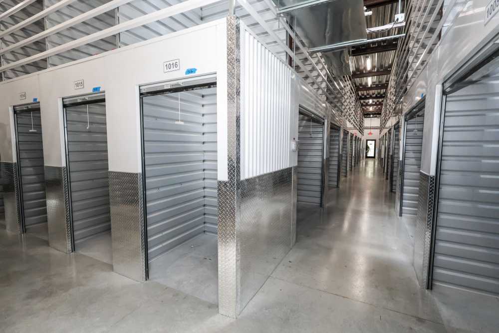 Climate-controlled storage unit corridor with numbered units at Your Storage Units Ft Pierce in Fort Pierce, Florida