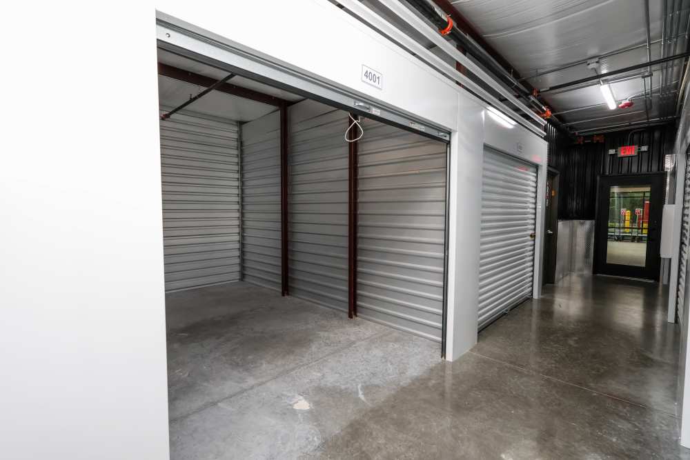 Climate-controlled storage unit with open roll-up door at Your Storage Units Bunnell in Bunnell, Florida
