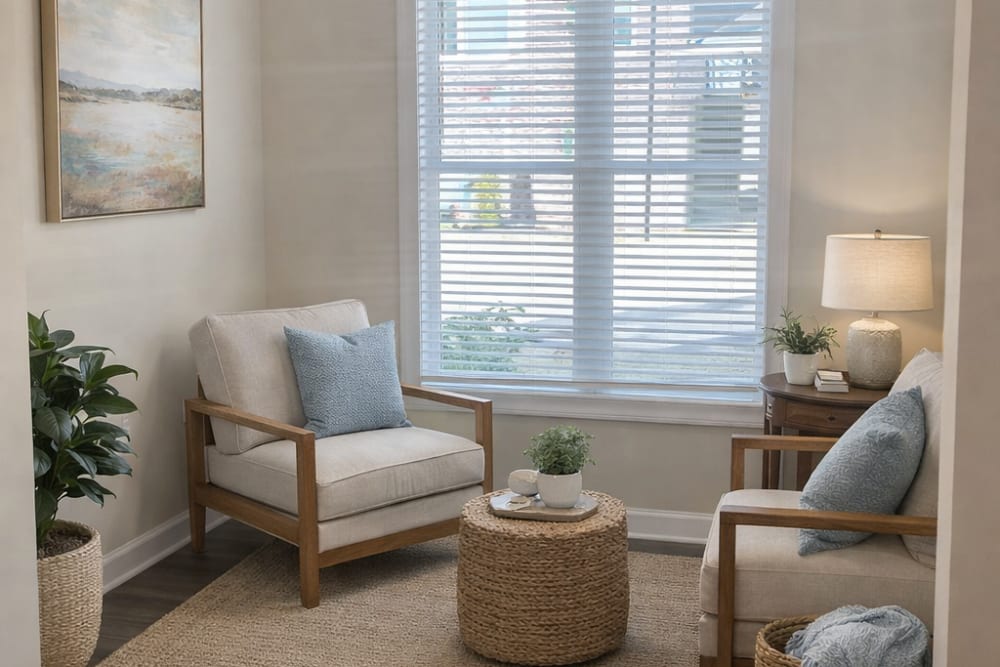 Furnished interior sunroom with plenty of natural lighting at Palisades of Wake Forest in Wake Forest, North Carolina