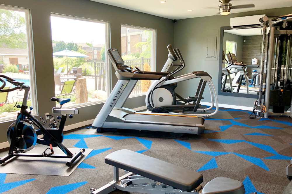 Exercise equipment in a fitness room at Collins Crossing Apartments in Carrboro, North Carolina
