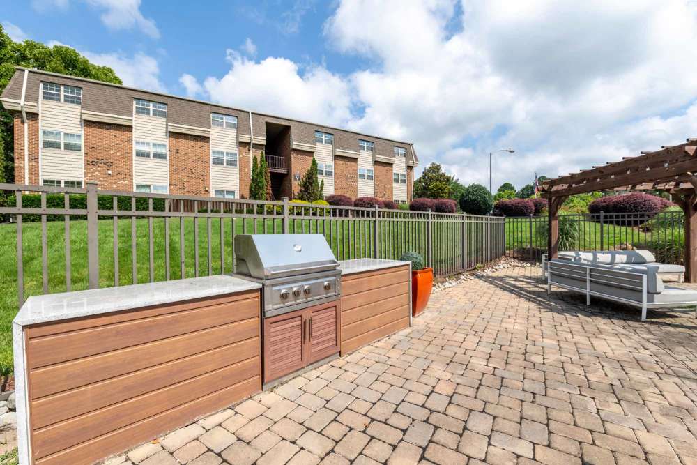 Grilling station with a barbecue grill at Collins Crossing Apartments in Carrboro, North Carolina