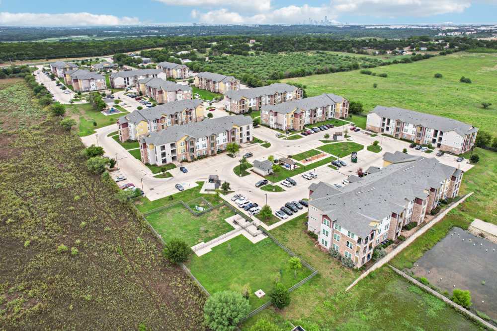 Bird's-eye view of modern manufactured homes and amenities at McKinney Falls Apartments in Austin, Texas