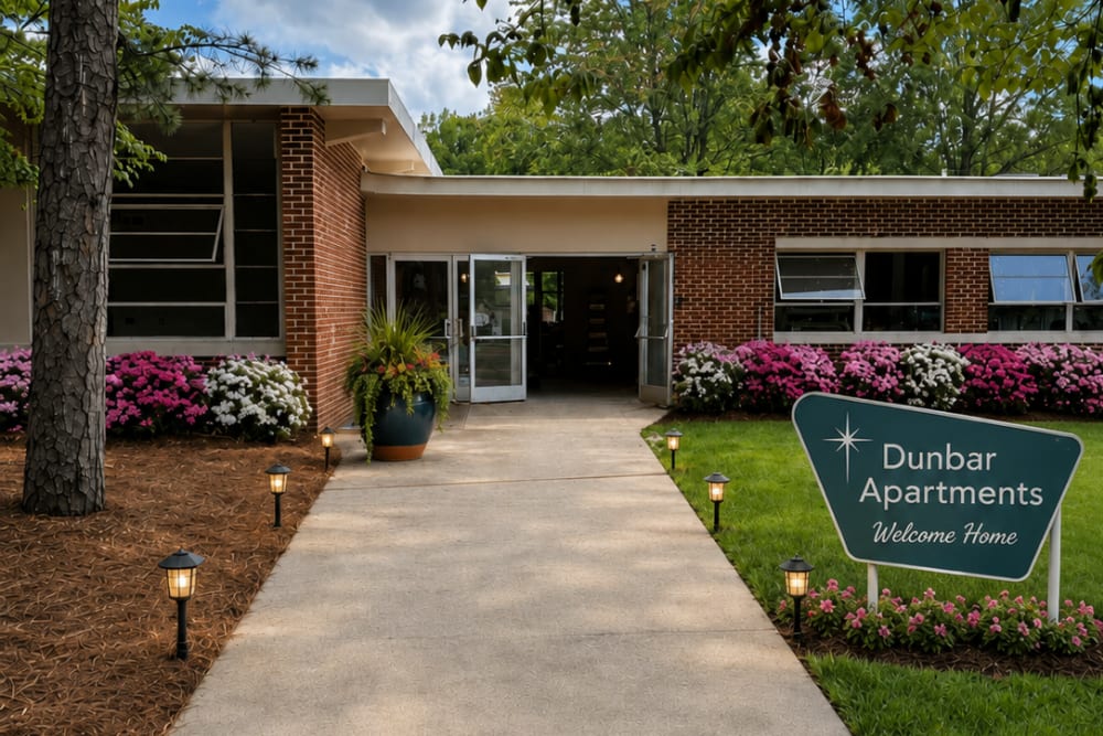 Modern apartment buildings with green landscaping at Dunbar Apartments in Lexington, North Carolina