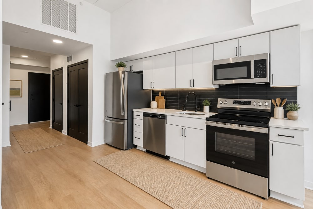 Black cabinets and stainless steel appliances at The Franklin in Ankeny, Iowa