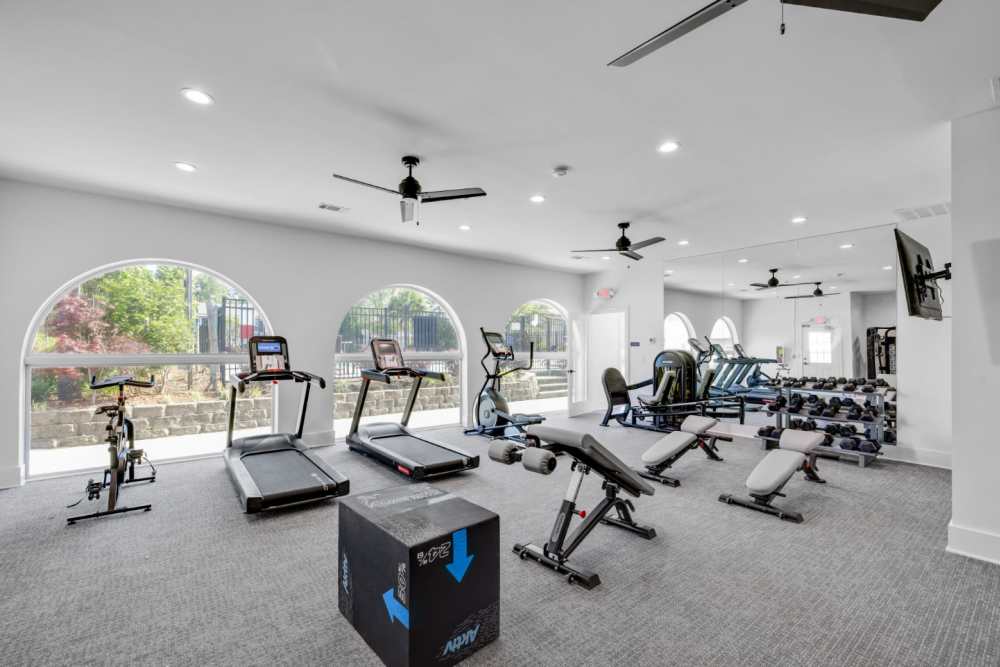 Bright, open fitness center with modern equipment at Crescent Place in Savannah, Georgia