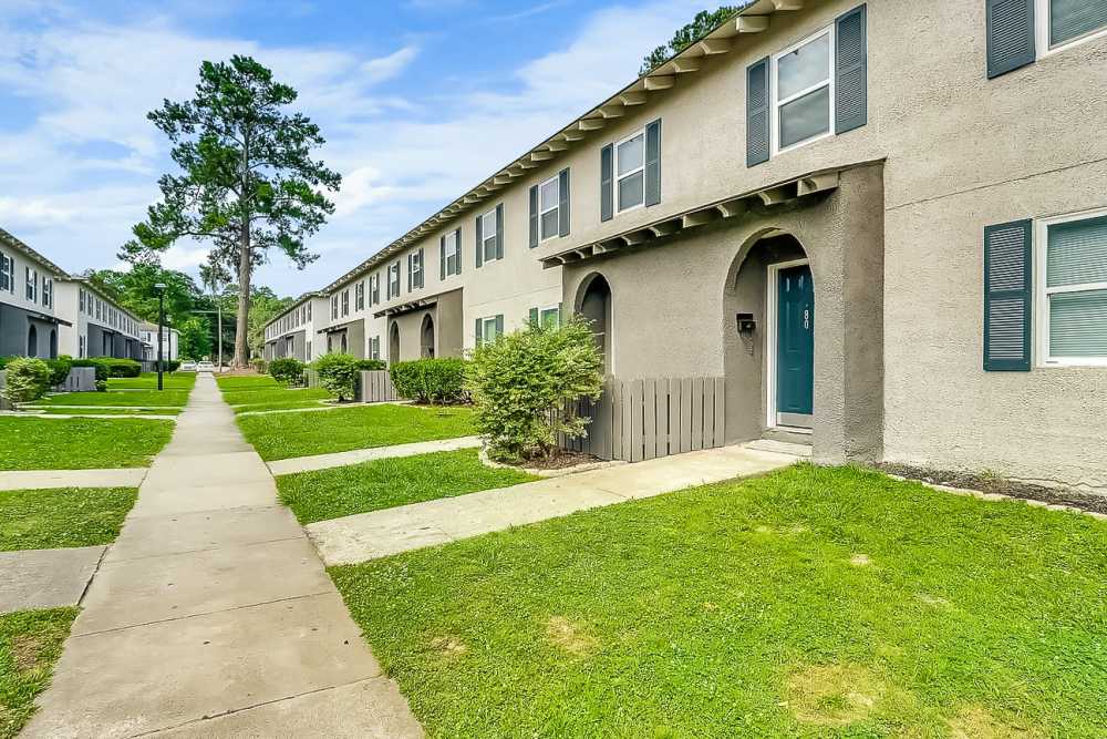 Building exteriors with landscaped pathways at Crescent Place in Savannah, Georgia