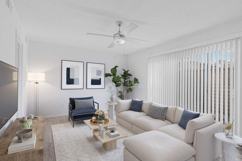 Light-colored sectional sofa with decorative pillows at Crescent Place in Savannah, Georgia