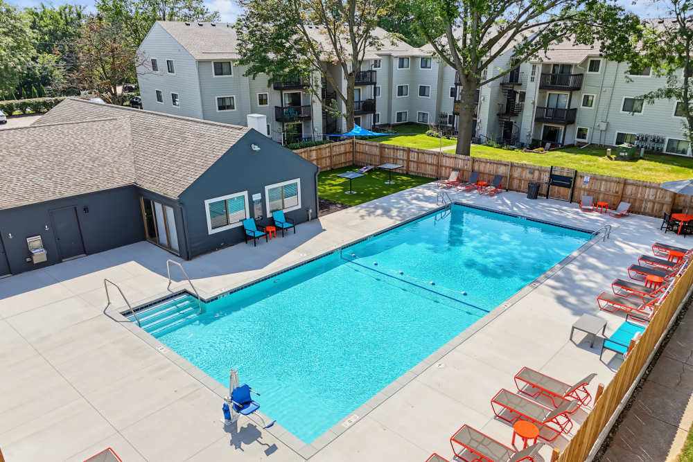 Resort-style pool with lounge chairs at Rock Ridge Commons in Moline, Illinois 