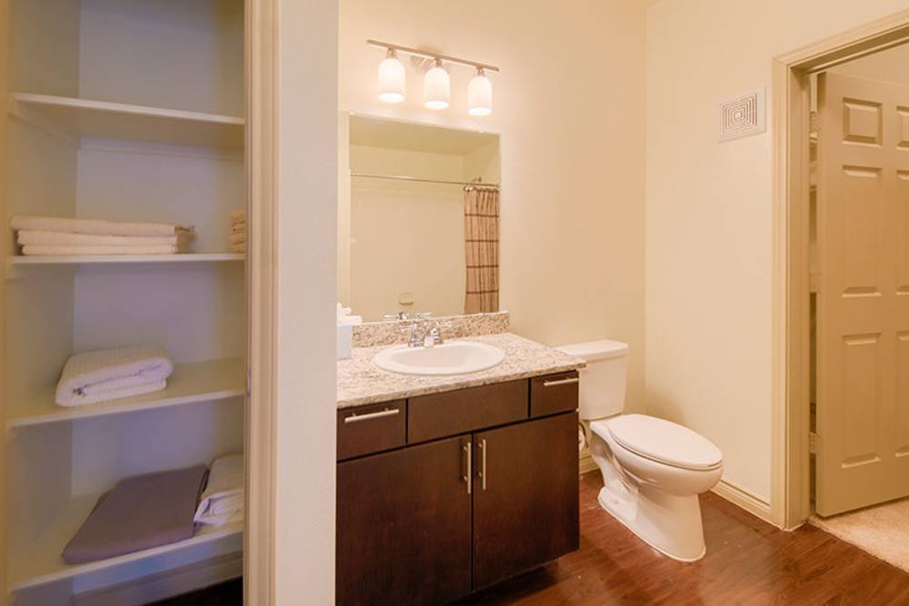 Bathroom vanity with sink and mirror at Midway Station in Midland, Texas