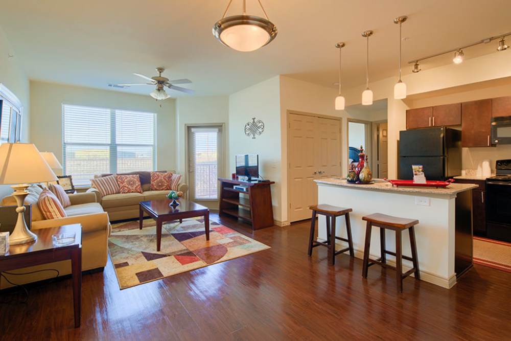 Sofa with decorative pillows and coffee table at Midway Station in Midland, Texas