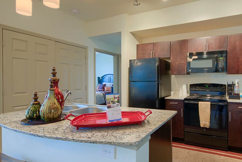 Colorful decorative vases on kitchen counter at Midway Station in Midland, Texas