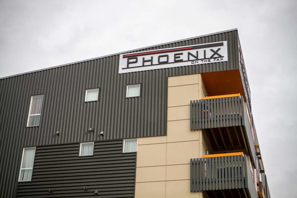 Building exterior with balconies and signage at Phoenix On The Fax in Denver, Colorado