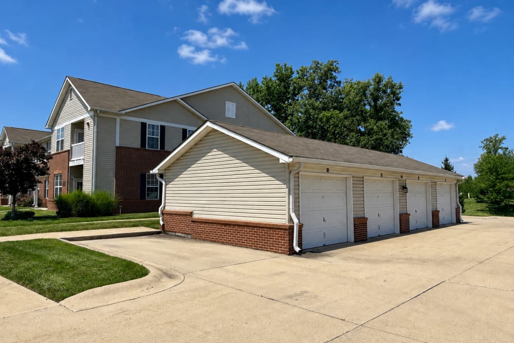 Detached garage building with paved driveway and landscaped grounds at Bluestone in Greenfield, Indiana