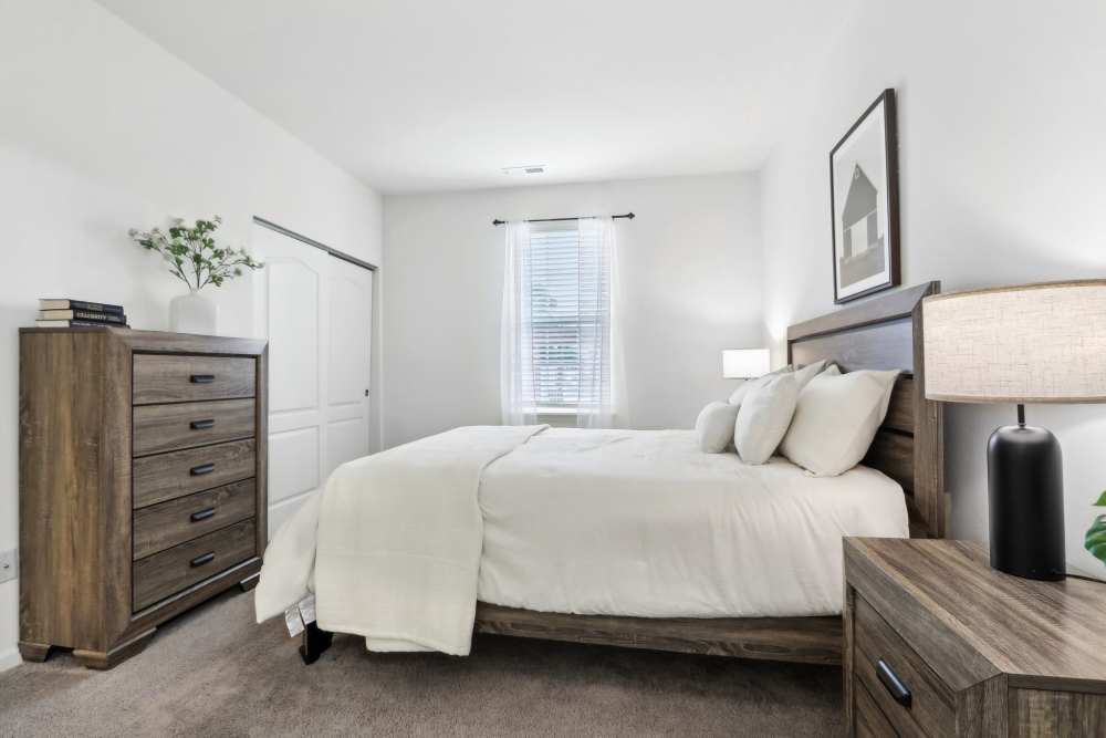 Spacious bedroom with neutral decor and natural light at Bluestone in Greenfield, Indiana