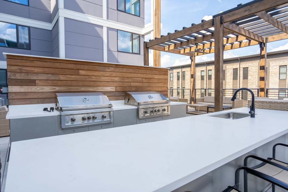 Grilling stations with countertops and seating at Eddy on the James in Richmond, Virginia