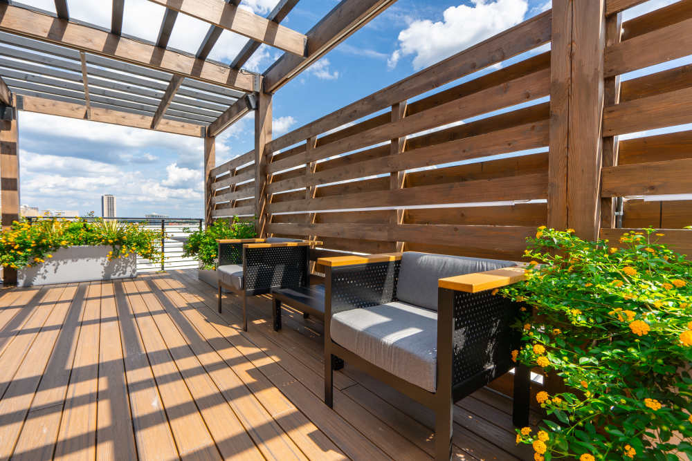 Wooden pergola with seating and planters at Eddy on the James in Richmond, Virginia