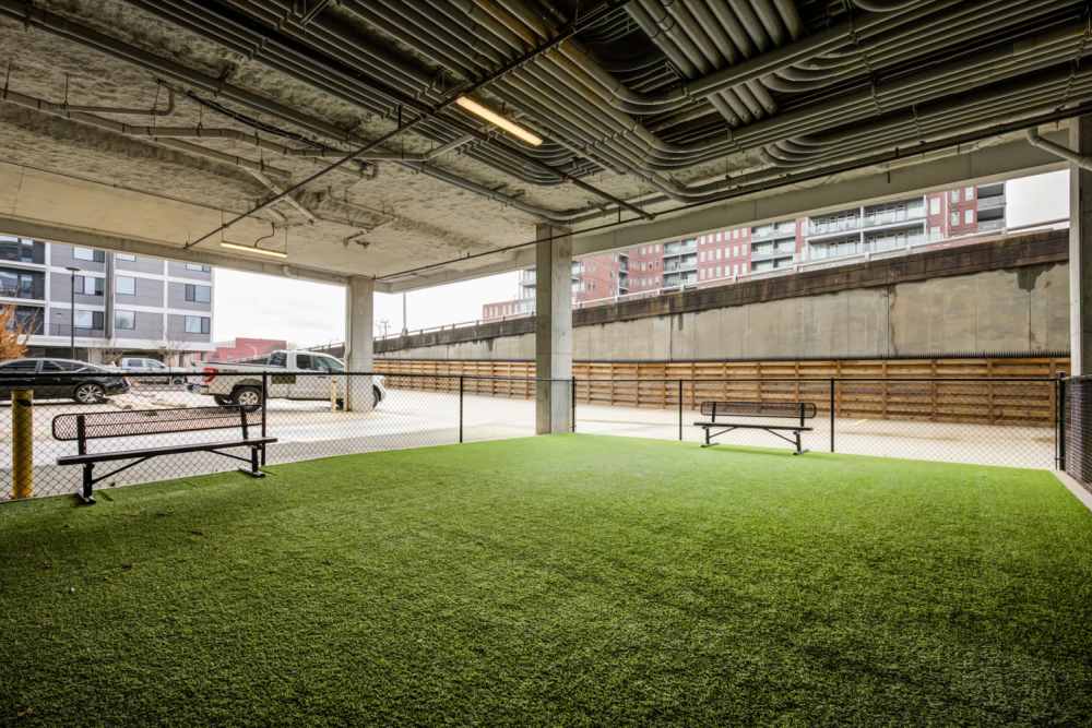 Artificial grass area with benches at Eddy on the James in Richmond, Virginia