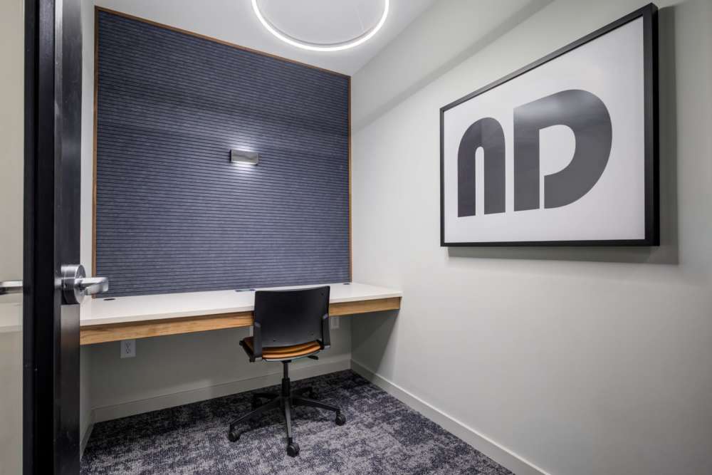 Desk with chair and wall art at Eddy on the James in Richmond, Virginia