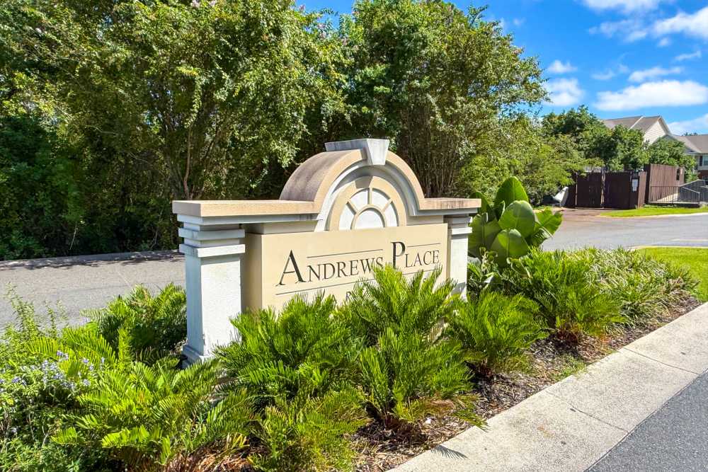 Monument entrance sign with landscaping at Andrews Place in Panama City, Florida