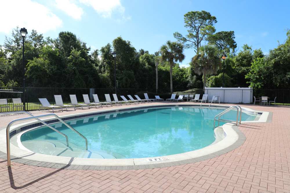 Pool with lounge chair at Andrews Place in Panama City, Florida