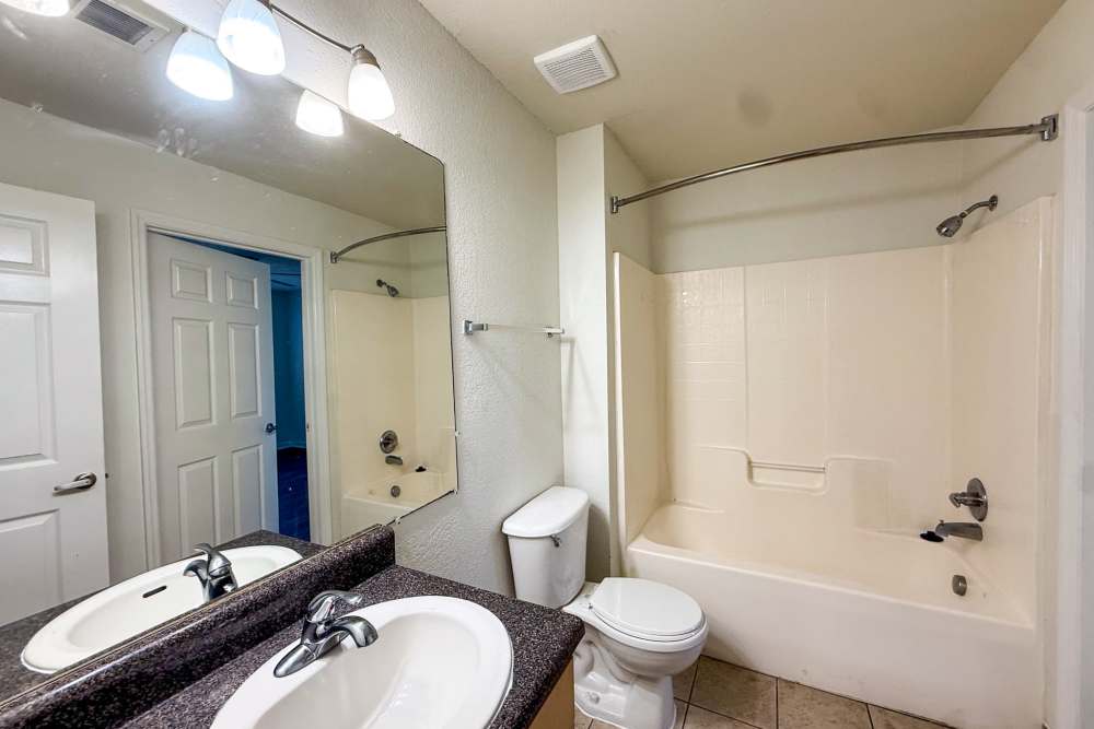 Bathroom with vanity mirror at Andrews Place in Panama City, Florida