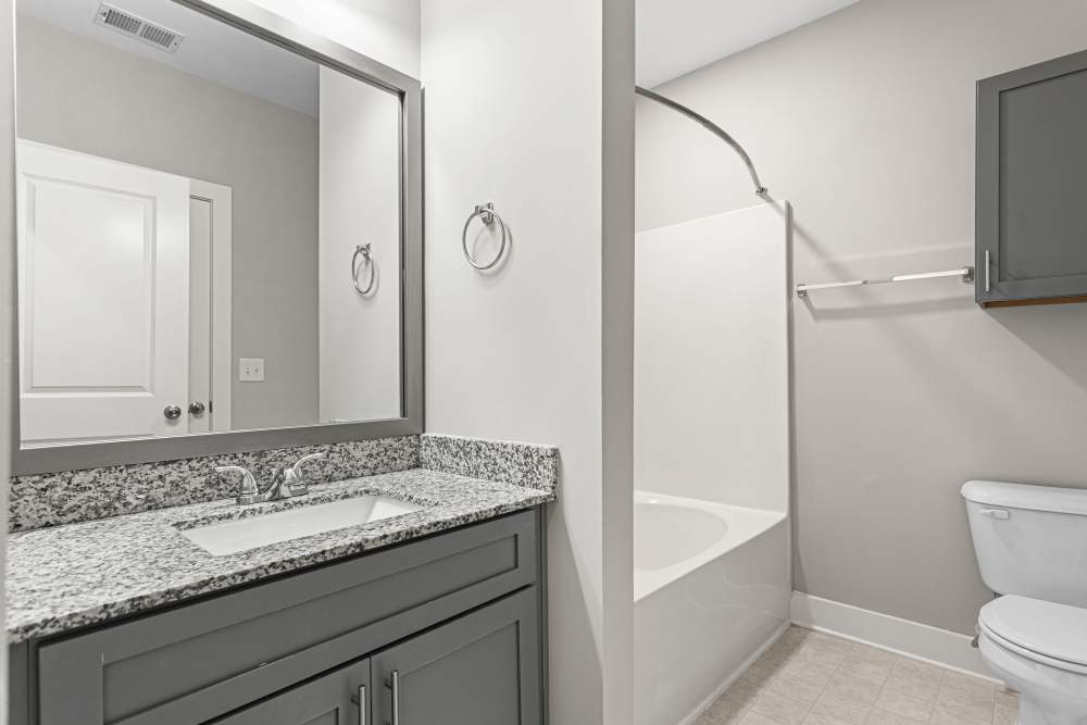 Peaceful master bedroom at Keystone At James Landing in Jamestown, North Carolina