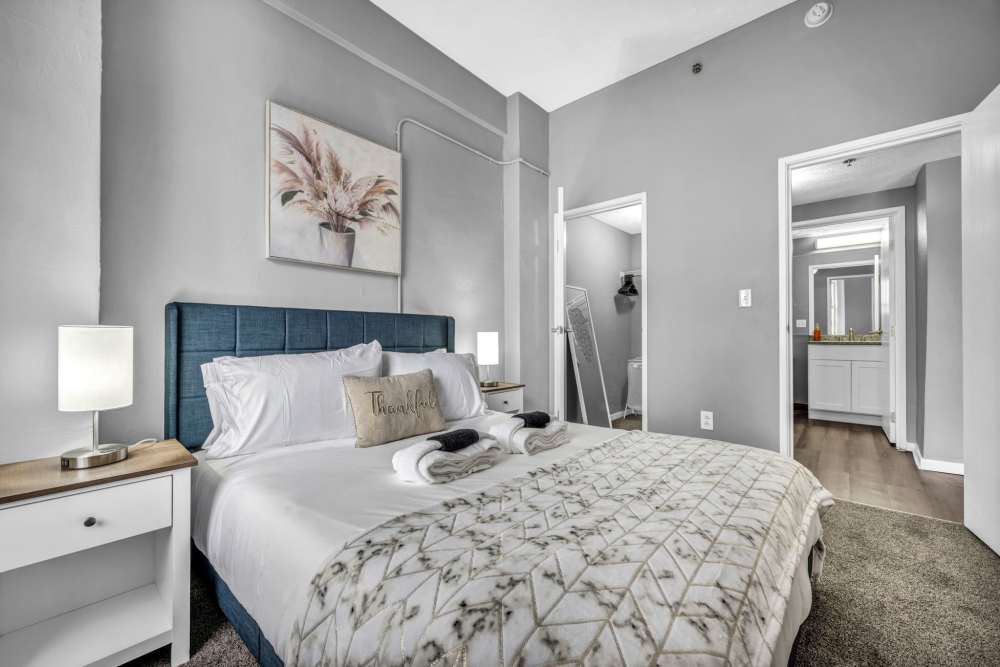 Cozy bedroom with soft lighting at Huron Square and The Osborn in Cleveland, Ohio
