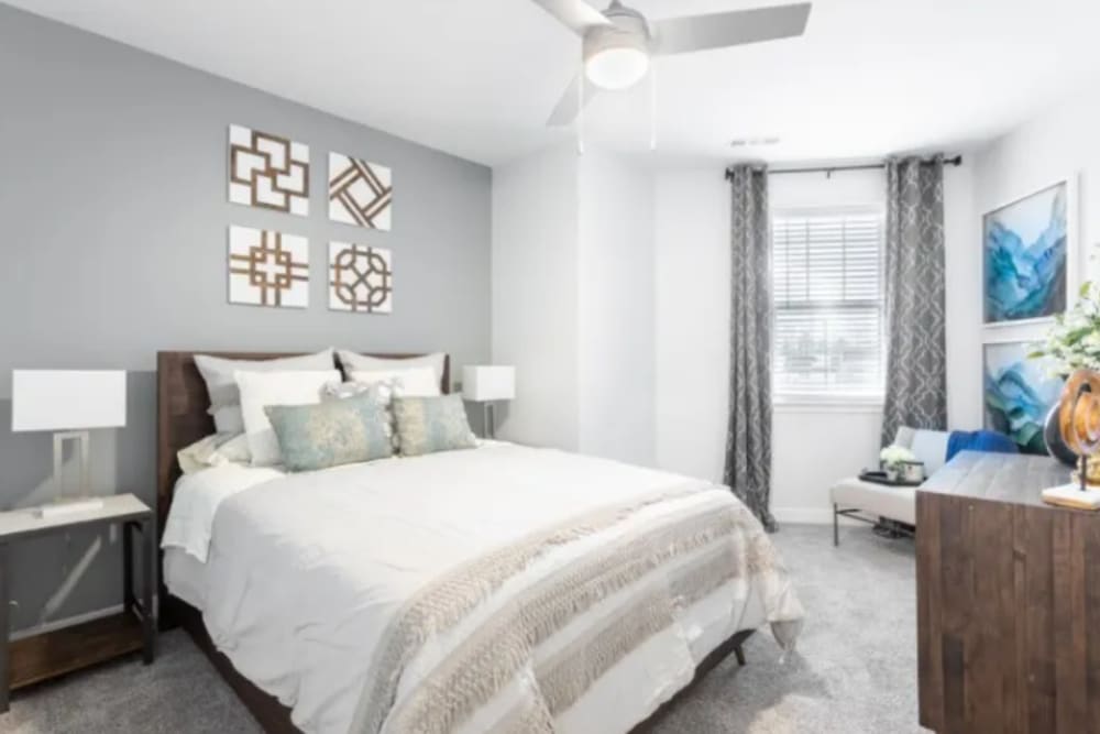 Bedroom with queen bed and window at River Point West in Elkhart, Indiana