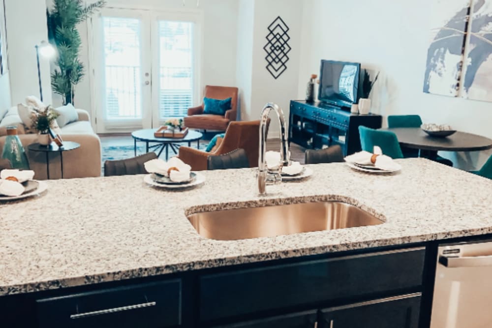 Kitchen island overlooking open living space at River Point West in Elkhart, Indiana