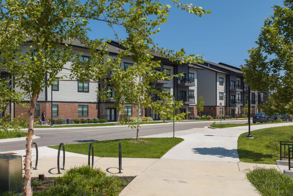 Apartment building exterior with landscaped walkway at River Point West in Elkhart, Indiana