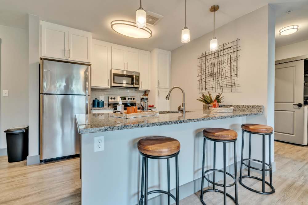 Kitchen countertop with sink and appliances at Latitude at South Portland in Portland, Maine