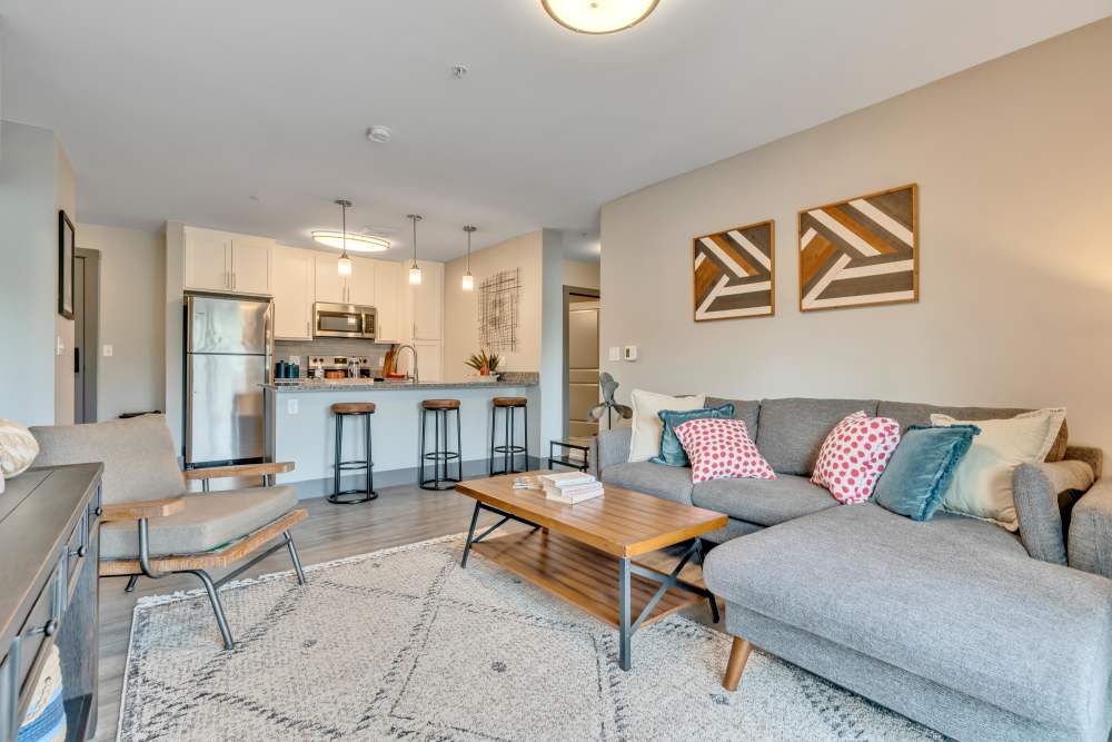 Gray walls with orange accent and bar stools at Latitude at South Portland in Portland, Maine