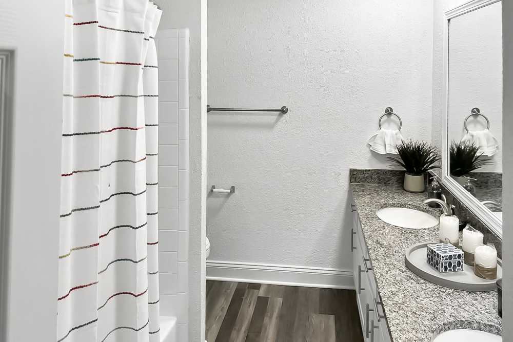 White shower curtain with colorful stripes at Crescent Place in Savannah, Georgia