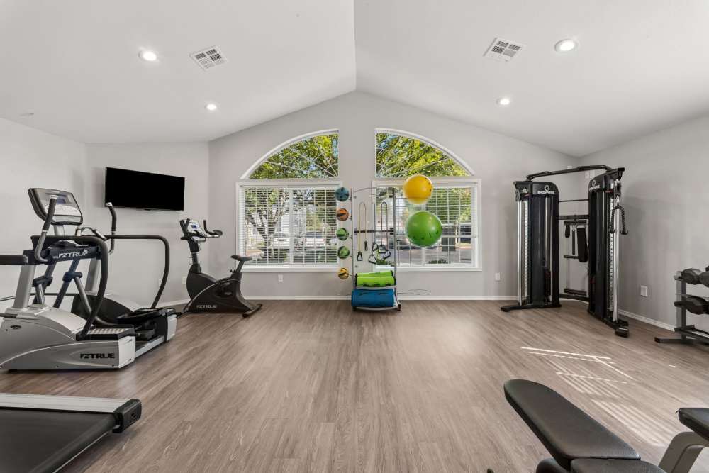 Fitness center with cardio and strength equipment at Fieldstone in Fairview, Oregon.