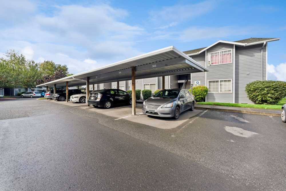 Covered carport parking beside apartment building at Fieldstone in Fairview, Oregon.