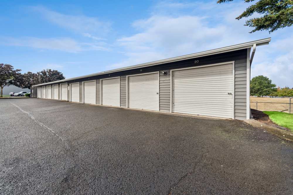 Detached garages with paved parking area at Fieldstone in Fairview, Oregon.