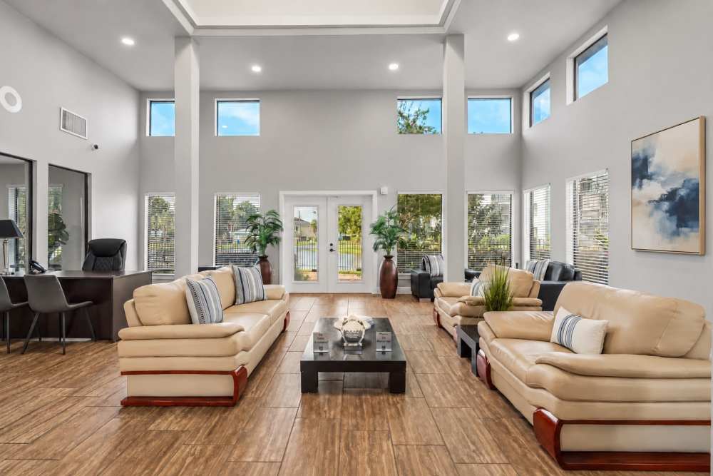 Resident clubhouse with sofas at Waterstone At Carrollwood in Tampa, Florida