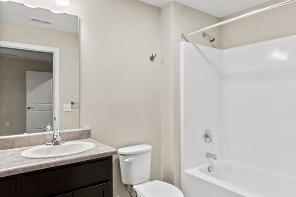 A luxurious bedroom with a comfy bed at Davis Pointe in Sumter, South Carolina