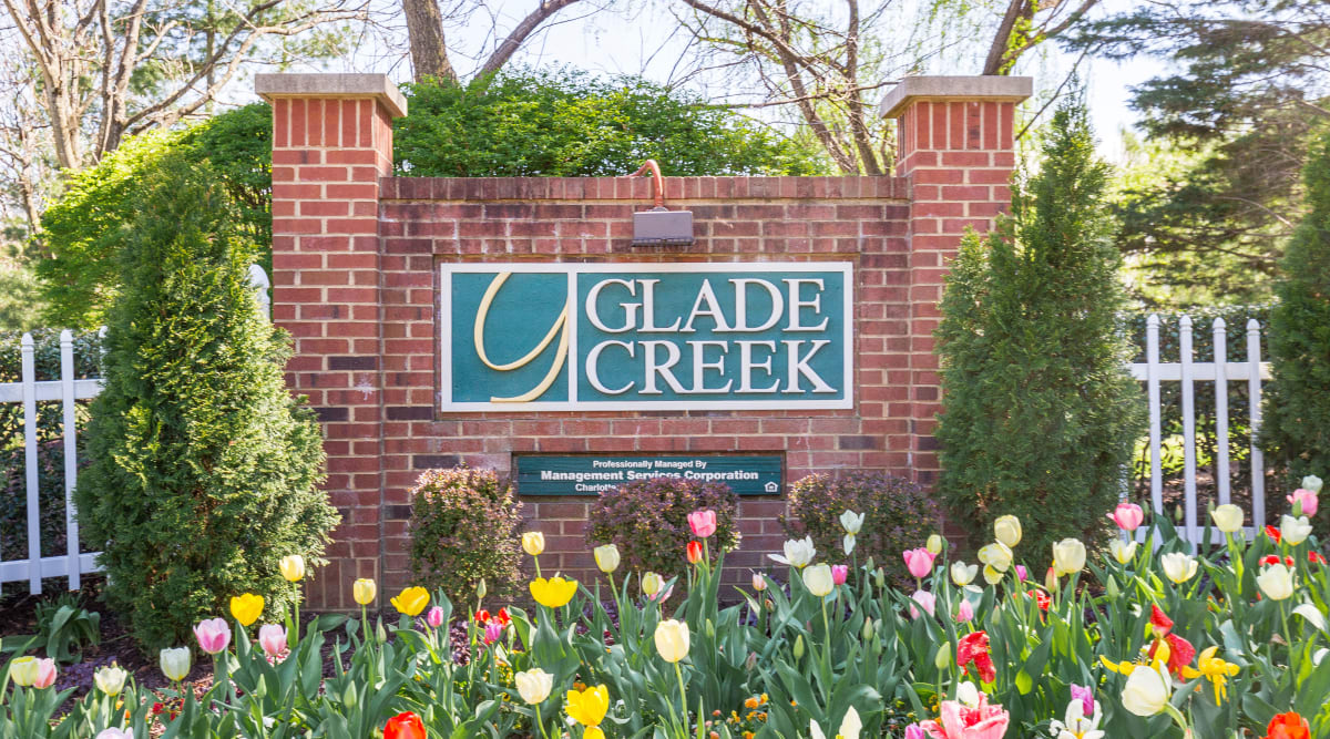 Entry way signage and garden of Glade Creek Apartments in Roanoke, Virginia