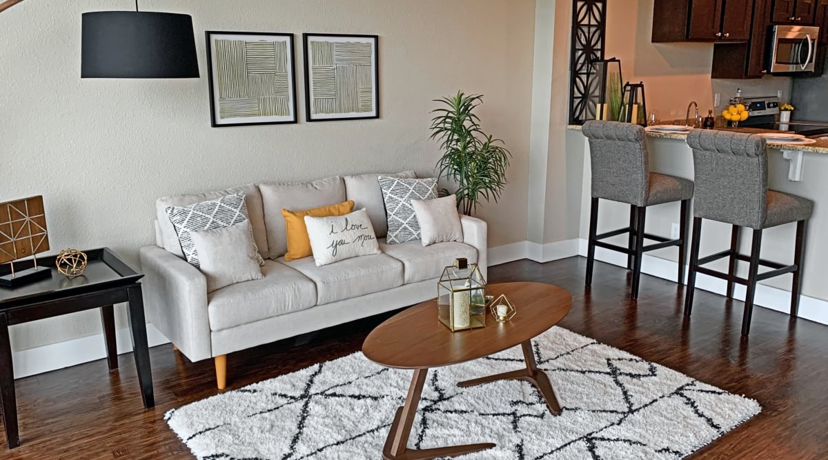 Living room with wood-style flooring at The View Tower Apartments, Shreveport, Louisiana