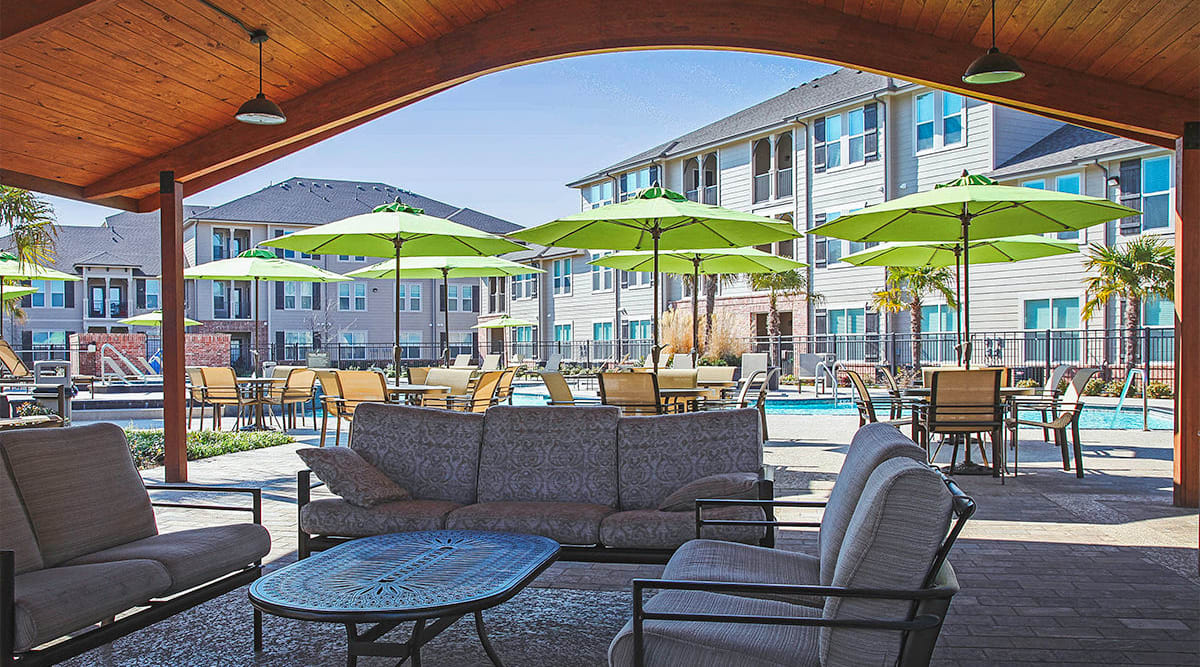 Covered poolside patio at Le Rivage Luxury Apartments in Bossier City, Louisiana