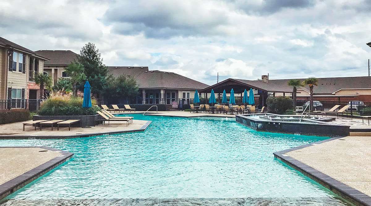 Sparkling blue water in resort-style pool at Le Rivage Luxury Apartments in Bossier City, Louisiana