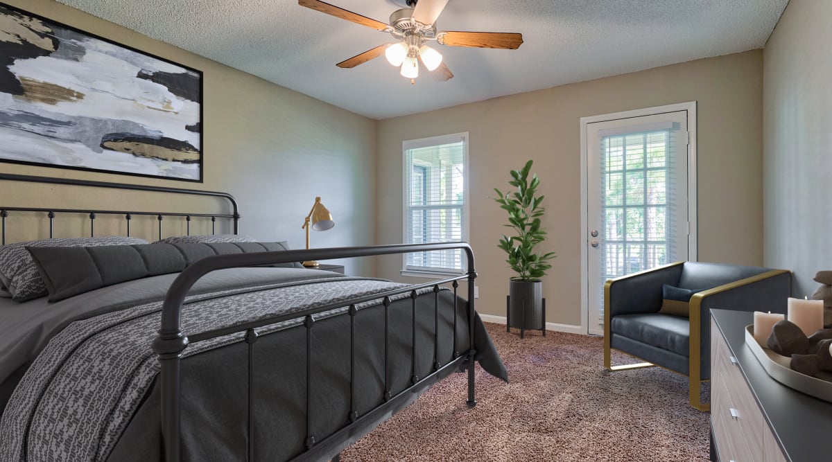Bedroom with bathroom attached at The Gatsby at Midtown Apartment Living in Montgomery, Alabama